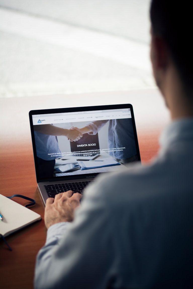 man operating the MacBook Pro