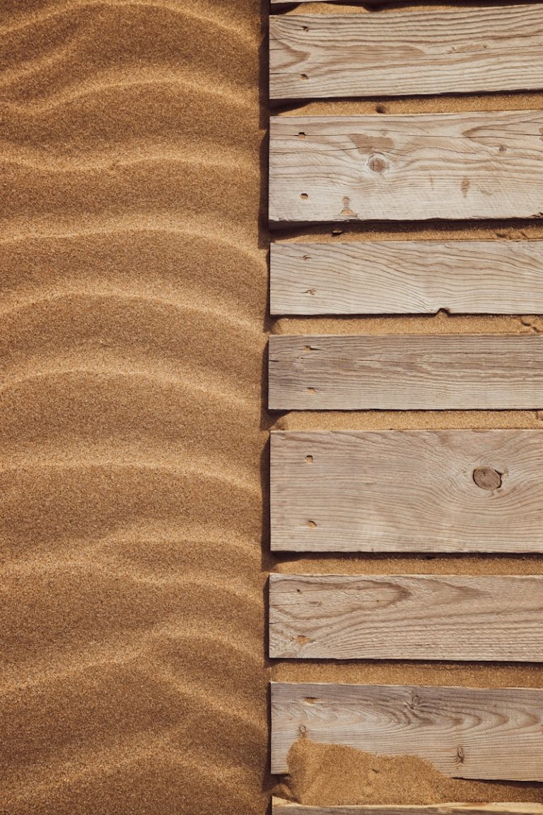 a close up of a wooden plank on a beach