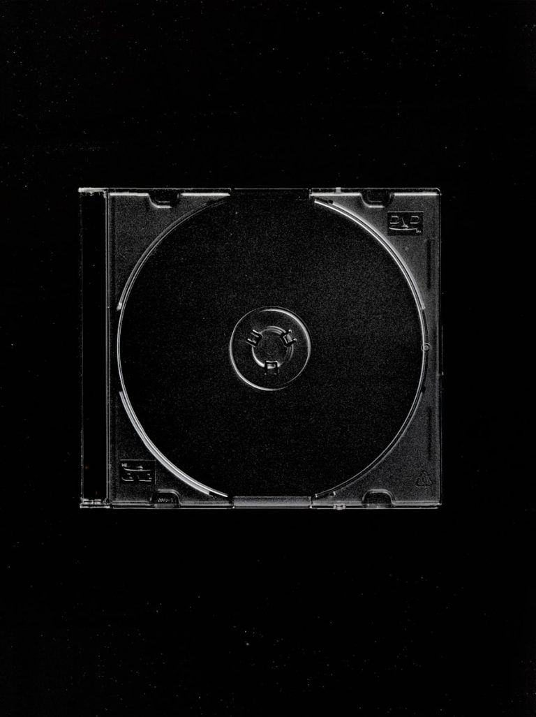 a black and white photo of a cd case