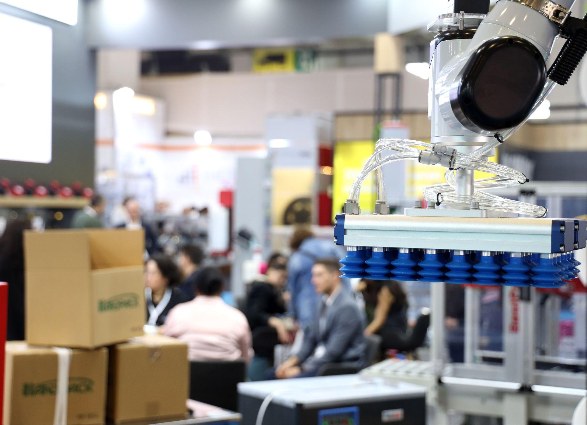 October 2026 brings the world's packaging sector back to Istanbul: a robotic vacuum gripper lifting cartons on an exhibitor stand at Eurasia Packaging Istanbul